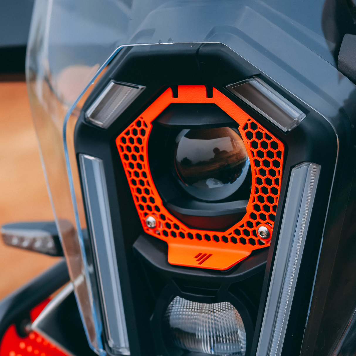 2025 ADV HEADLIGHT GRILL ORANGE